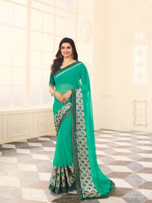 Have A Fresh And Pretty Look Everytime You Wear This Shade Of Green wih This Saree In Sea Green color Paired With Teal Green Colored Blouse. This Saree Is Fabricated On Georgette Paired With Art Silk Fabricated Blouse. Buy This Saree Now.