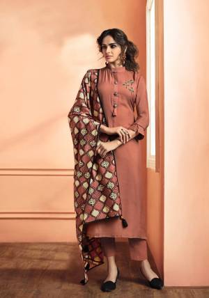 New And Unique Shade Is Here with This Readymade Suit In Dusty Peach Colored Top And Bottom Paired With Dusty Peach And Cream Colored Dupatta. Its Readymade Top Is Fabricated On Muslin Silk Paired With Unstitched Santoon Bottom And Printed Cotton Dupatta.