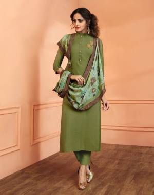One Of The Best Shade In Green Is Here With This Readymade Suit In Olive Green Colored Top And Bottom Paired With Light Green Colored Dupatta. Its Top Is Fabricated On Muslin Silk Paired With Santoon Bottom And Soft Silk Dupatta. Buy It Now.
