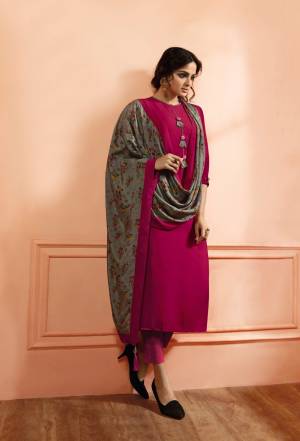 Shine Bright In this Designer Straight Suit In Magenta Pink Color Paired With Contrasting Grey Colored Dupatta. Its Readymade Top IS Fabricated On Muslin Silk Paired With Unstitched Santoon Bottom And Satin Silk Dupatta. 
