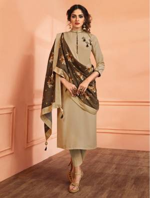 Simple, Rich And Elegant Looking Designer Straight Suit Is Here In Beige Color Paired With Brown Colored Bottom. Its Fully Stitched Top Is Fabricated On Muslin Silk Paired With Santoon Bottom And Muslin Silk Dupatta. Buy Now.