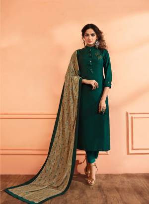 Enhance Your Personality Wearing This Rich Looking Designer Straight Suit In Pine Green Color Paired With Beige Colored Dupatta. Its Top Is Fabricated On Muslin Silk Paired With Santoon Bottom And Cotton Dupatta. All Its Fabric Ensures Superb Comfort All Day long.