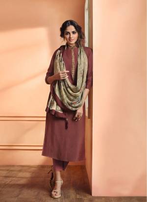 Quite An Uncommon Shade Is Here With This Designer Straight Readymade Suit In Light Wine Color Paired With Contrasting Grey Colored Dupatta. Its Top Is Fabricated On Muslin Silk Paired With Santoon Bottom And Soft Silk Dupatta. Buy Now,