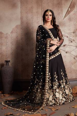 This set features designer black color heavily embellished lehenga choli. It is paired with matching black flared crepe base lehenga with matching crepe base blouse with soft net dupatta set.