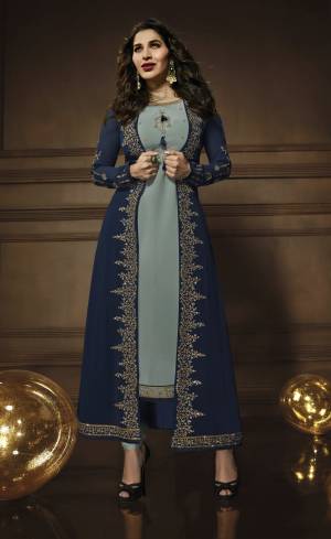 Rich And Elegant Looking Color Combination Is Here With This Suit In Light Blue Colored Top, Bottom And Dupatta Paired With Navy Blue Colored Jacekt. Its Top, Jacket And Dupatta Are Georgette Fabricated Paired With Santoon Bottom. All Its Fabric Are Light Weight And Comfortable To Carry.