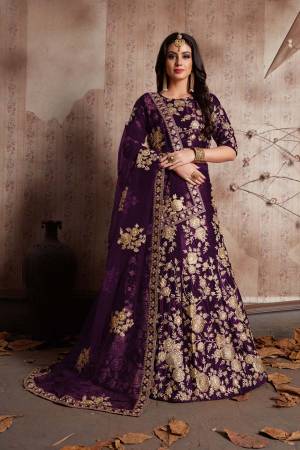 This set features a purple velvet dori work lehenga choli set. It comes along with lace work dupatta and heavy embroidery on dupatta's net. Matching blouse with heavy dori dori work.Looks completely heavy work.