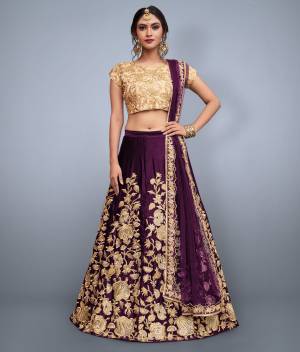 This set features purple velvet dori work lehenga choli set. It comes along with cut work dupatta on net base. Matching Beige Colored  blouse with heavy dori work.Looks completely heavy work.