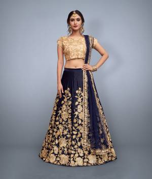 This set features a nay blue velvet dori work lehenga choli set. It comes along with cut work dupatta on net base. Matching blouse with heavy dori work. Looks completely heavy work.