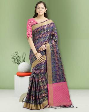 Enhance Your Perosnality, Draping This Bright And Attractive Navy Blue Colored Saree Paired With Contrasting Pink Colored Blouse. This Saree And Blouse Are Fabricated On Art Silk Beautified With Weave All Over. Buy Now.