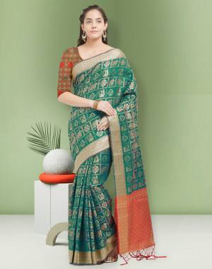 Here Is A Lovely Shade In Green With This Silk Saree In Teal Green Color Paired With Red Colored Blouse. This Saree And Blouse Are Fabricated On Art Silk Beautified With Weave All Over. It Is Light Weight And Easy To Drape.