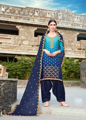 Enhance Your Beauty Wearing This Designer Suit In Navy Blue Color Paired With Navy Blue Colored Bottom And Dupatta. Its Top Is Fabricated On Soft silk Paired With Santoon Bottom And Chiffon Dupatta. It Is Beautified With Jari Embroidery And Stone Work.