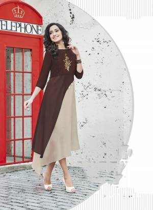 Elegant And Rich Looking Designer Readymade Kurti Is Here In Brown And Beige Color Fabricated On Georgette Beautified with Embroidery Over The Yoke. 