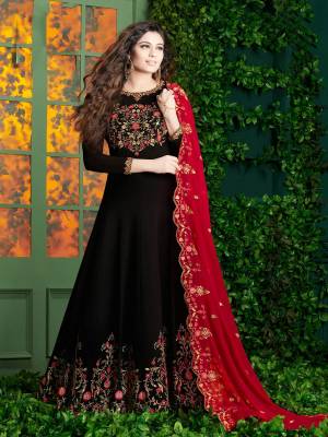 For A Bold And Beautiful Look, Grab This Designer Floor Length Suit In Black Color Paired With Red Colored Dupatta. Its Top And Dupatta Are Georgette Fabricated Paired With Santoon Bottom. Its Fabrics Ensured Superb Comfort All Day Long.