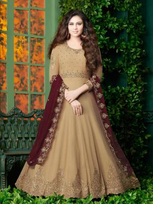 Flaunt Your Rich And Elegant Look Wearing This Designer Floor Length Suit In Brige Color Paired With Beige Colored Bottom And Maroon Colored Dupatta. It Top Is Fabricated On Georgette Paired With Santoon Bottom And Georgette Dupatta. It Has Very Pretty Embroidery over The Top And Dupatta. Buy Now.