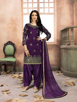Grab This Amazing Designer Salwar Suit In Purple Color Paired With Purple Colored Bottom And Dupatta. Its Top Is Fabricated On Art Silk Paired With Santoon Bottom And Net Dupatta. It IS Beautified with Jari Embroidery And Mirror Work. Buy Now.