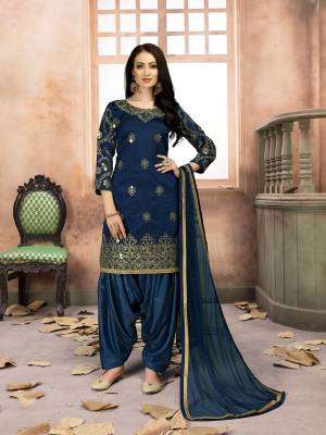 Grab This Amazing Designer Salwar Suit In Navy Blue Color Paired With Navy Blue Colored Bottom And Dupatta. Its Top Is Fabricated On Art Silk Paired With Santoon Bottom And Net Dupatta. It IS Beautified with Jari Embroidery And Mirror Work. Buy Now.