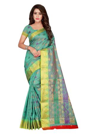 Pretty Elegant Looking Sea Green Colored Silk Saree Is Here Paired With Sea Green Colored Blouse. This Saree And Blouse are fabricated On Banarasi Art Silk Beautified With Weave. Buy This Saree Now.
