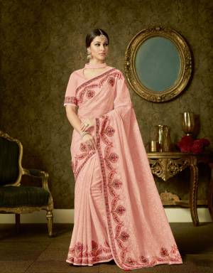 Compliment your simplicity and feminity in this subtle Peach saree with ornate threadwork. Add beuatiful chandbalis and subtle pink makeup to look ravishing. 