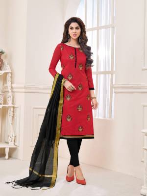 Adorn the pretty angelic look wearing this dress material in red colored top paired with black colored bottom and dupatta. Its top and bottom are cotton based paired with chanderi dupatta. Buy this suit now.