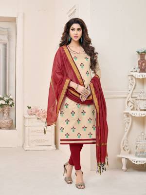 Simple and elegant looking dress material is here in beige colored top paired with maroon colored bottom and dupatta. Its top and bottom are fabricated on cotton paired with chanderi dupatta. It is beautified with embridered motifs all over.