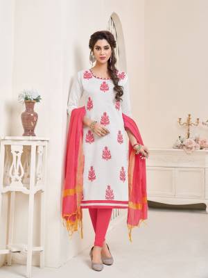 Simple and elegant looking dress material is here in white colored top paired with dark peach colored bottom and dupatta. Its top and bottom are fabricated on cotton paired with chanderi dupatta. It is beautified with embridered motifs all over.