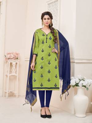 Grab this beautiful dress material in green colored top paired with contrasting navy blue colored bottom and dupatta. Its top and bottom are fabricated on cotton paired with chanderi dupatta. Buy this dress material now.