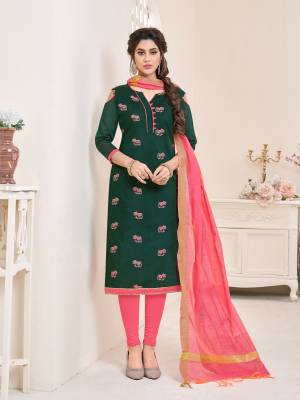 You will definitely earn lots of compliments from wearing this beautiful pine green colored top paired with contrasting pink colored bottom and dupatta. Its top and bottom are cotton based paired with chanderi dupatta. Buy this suit now.