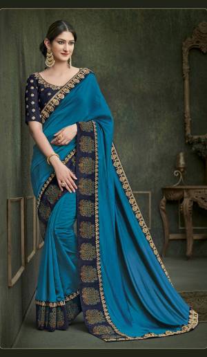 Go With The Shades Of Blue With This Pretty Saree In Blue Color Paired With Navy Blue Colored Blouse. This Saree Is Fabricated On Soft Silk Paired With Art Silk Fabricated Blouse. Its Lovely Color Pallete And Embroidery Will earn You Lots Of Compliments From Onlookers.