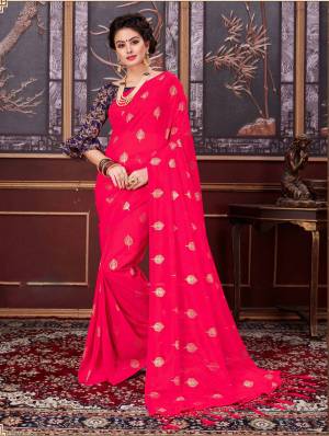 Bright and visually appealing color is here with this designer saree in fuschia pink color paired with Contrasting Navy blue colored blouse. This saree is fancy net fabricated paired with jacquard silk fabricated blouse. Buy this saree now.
