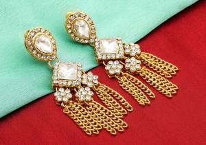 Be It A Simple Kurti Or Heavy Dress, This Pretty Elegant Earrings Set Is Suitable For Both, Grab This Lovely Set Of Earrings Beautified With White Colored Stones And Pearls. Buy Now.