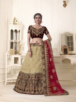 For a royal and unique look, grab this heavy designer lehenga choli which will earn you lots of compliments from onlookers. Its blouse is in brown color paired with beige colored lehenga and red colored dupatta. Its blouse is fabricated on velvet paired with art silk and velvet fabricated lehenga and net dupatta. Buy now.