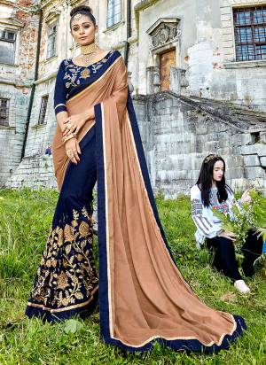 Enhance Your Personality Wearing This Designer Saree In Beige And Dark Blue Color Paired With Dark Blue Colored Blouse. This Saree Is Fabricated On Silk and Georgette Paired With Art Silk Fabricated Blouse. Its Lovely Color Pallete Will Earn You Lots OF Compliments.