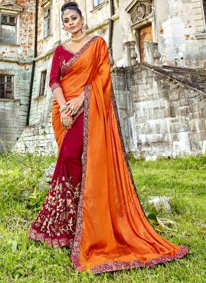 Celebrate This Festive Season With Bright Colors Wearing This Designer Saree In Orange And Maroon Color Paired With Maroon Colored Blouse. This Saree Is Fabricated On Silk And Georgette Paired With Art Silk Fabricated Blouse. Buy This Beautiful Saree Now.