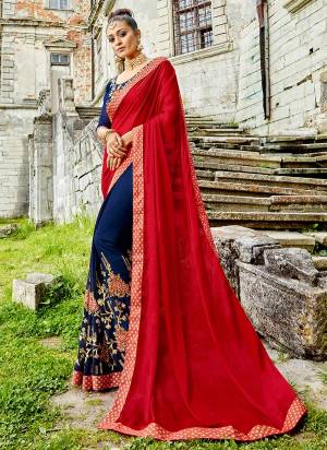 Go Colorful Wearing This Designer Saree In Red And Blue Color Paired With Blue Colored Blouse, This Saree IS Based On Silk Georgette Paired With Art Silk Fabricated Blouse. It Has Pretty Embroidery Over The Saree Panel And Blouse.