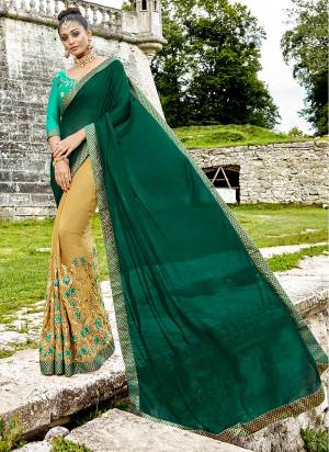 Get Ready For The Upcoming Festive Season Wearing This Designer Saree In Pine Green And Beige Color Paired With Green Colored Blouse. This Saree IS Fabricated On Silk Georgette Paired With Art Silk fabricated Blouse. Buy Now.
