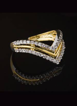 Give A Very Pretty Look To Your Soft Beautiful Hands With This Lovely Designer Ring In Golden Color Beautified With Lovely Diamond Work. This Pretty Ring Can Be Paired With Any Colored Attire. Buy Now.