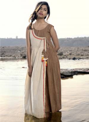 Add This Lovely linen long maxi casual dress has a Cream Denim Khadi as major part and beige flape?in angarkha style. 
Sleeveless pattern with minute laces are clubbed with hand-made pompom hangings.? 
khadi is a fabric that will keep you cool in summers and warm in winters.
 So it suits to wear in?all seasons