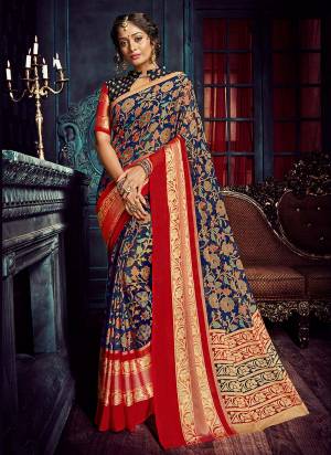 Grab This Rich Looking Saree In Navy Blue Color Paired With Navy Blue Colored Blouse. This Saree Is Fabricated On Chiffon Brasso Paired With Jacquard Silk Fabricated Blouse. It Has Lovely Colorful Jari Weave All Over The Saree. Buy This Saree Now.