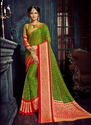 Celebrate This Festive Season Wearing This Saree In Green Color Paired With Green Colored Blouse. This Has Base With Chiffon Brasso Paired With Jacquard Silk Fabricated Blouse. Both The Fabrics Are Light Weight And Easy To Carry All Day Long.