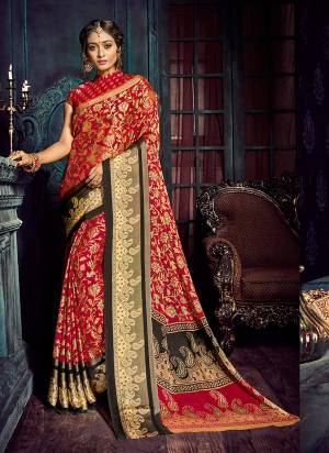 Adorn The Pretty Angelic Look Wearing This Rich And Elegant Looking Saree In Red Color Paired With Red Colored Blouse. This Saree Is Fabricated On Chiffon Brasso Paired With Jacquard Silk Fabricated Blouse. Buy This Saree Now.