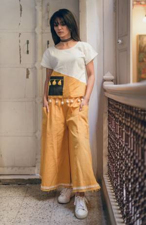 Pretty Simple Pair In Top And Pant Is Here With This White And Yellow Colored Top Paired With Yellow Colored Bottom. This Pair Is Khadi Cotton Based Which Is Suitable For All Season And Ensures Superb Comfort. Buy Now.