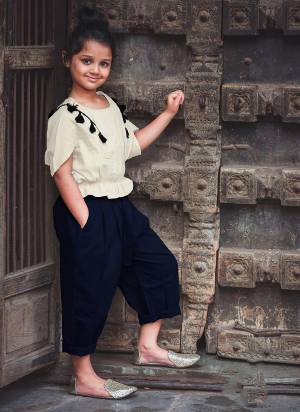 Be It Party Wear Or For An Outing This Lovely Pair Of Top And Pants Is Suitable For All. Its Top Is In Off-white Color Paired With Navy Blue Colored Bottom. This Khadi Cotton Based Dress Is Available In Sizes, Choose As Per Your Desired Comfort. Buy Now.