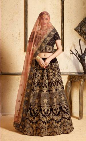 Get Ready For Your D-day With This Heavy Designer Bridal Lehenga choli In Brown Color Paired With Contrasting Peach Colored Dupatta. This Velvet Based Lehenga And Choli Are Beautified With Heavy Jari And Resham Embroidery With Stone Work. Its Soft Net Dupatta Can Be Drape As Per It Is Suitable To You. Its Fabric Also Ensures Superb Comfort Throughout The Gala And Earn You Lots Of Compliments From Onlookers. Buy Now.