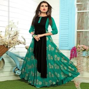 Grab This Designer Readymade Kurti In Sea Green And Black Color Fabricated On Rayon Beautified With Prints. This Long Pattern Kurti Is Available In Sizes And Also Ensures Superb Comfort All Day Long.