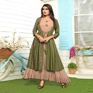 Elegant And Rich Looking Designer Readymade Kurti Is Here In Beige And Olive Green Color Fabricated On Rayon. Its Pretty Jacket Pattern Will earn You Lots Of Compliments From Onlookers. 