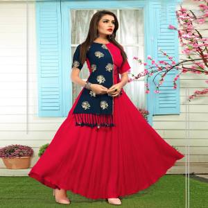 Attract All Wearing This Designer Readymade Kurti In Dark Pink And Navy Blue Color Fabricated On Rayon. It Is Light Weight And Ensures Superb Comfort All Day Long.