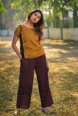 If Comfort Comes First Than Grab This Beautiful Khadi Western Pair In Musturd Yellow Colored Top Paired With Black Colored Bottom. This Readymade Pair Is Fabricated On Khadi Cotton. It Is Light Weight And Easy To Carry All Day Long.