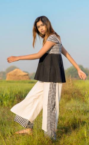 Simple And Elegant Looking Designer Readymade Western Pair Is Here In Black Colored Top Paired With White Colored Bottom. It IS Fabricated On Khadi Cotton, Buy Now.