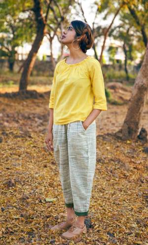 You Will Earn Lots Of Compliments Wearing this Readymade Western Pair In Yellow Colored Top Paired Off-White Colored Bottom. It Is Fabricated On Khadi Cotton Beautified With Prints. Buy Now.