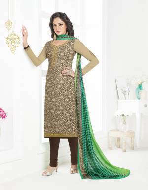 For Your Casual Or Semi-Casual Wear, Grab This Straight Suit In Beige Color Paired With Brown Colored Bottom And Green Colored Dupatta. This Dress Material Is Fabricated On Crepe Paired With Chiffon Dupatta. Buy Now.